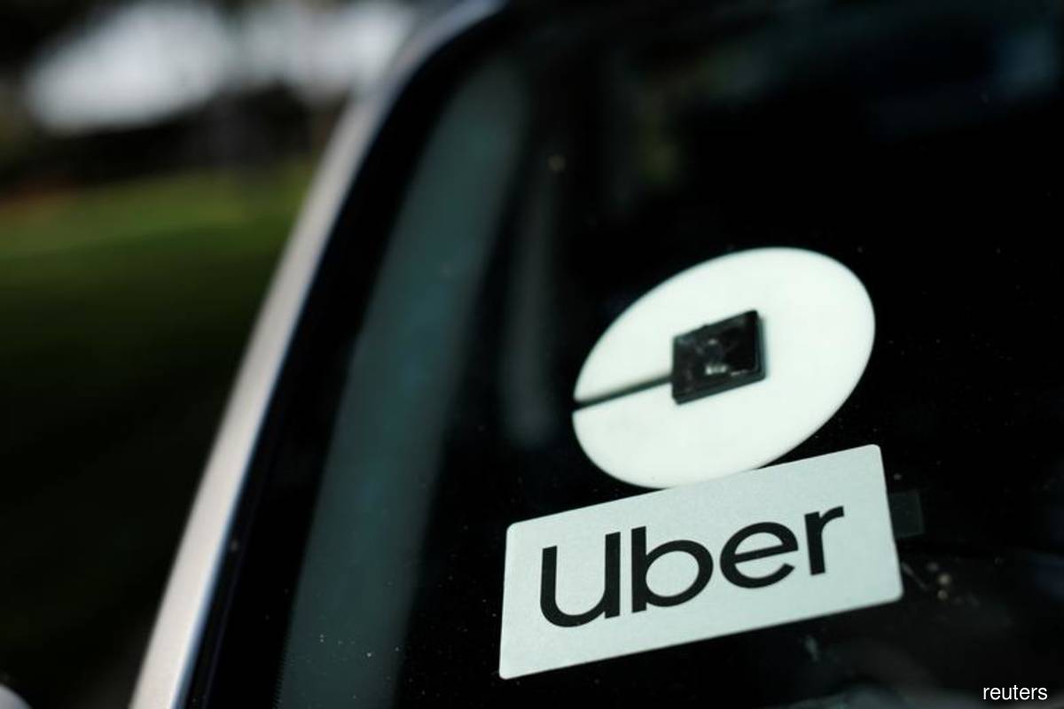 Uber looking to sell Didi, other non-strategic stakes, CEO says 