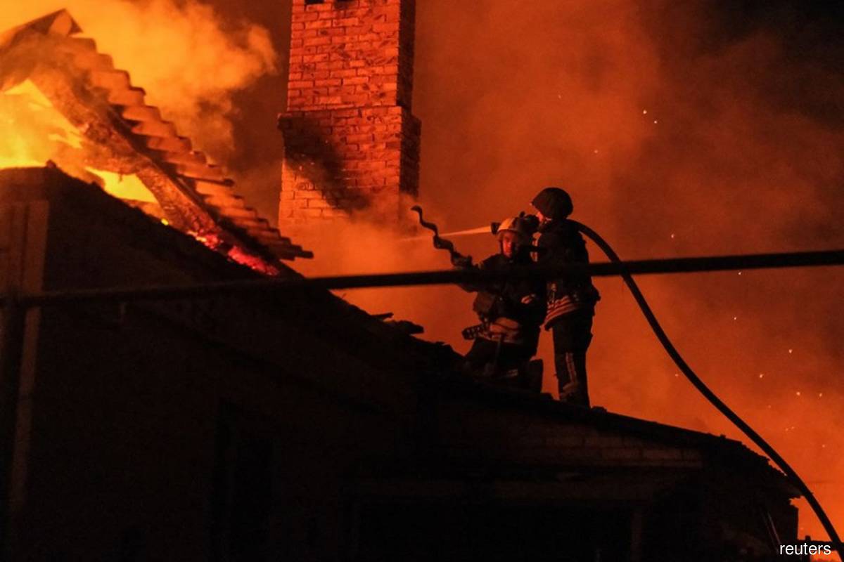 Ukrainian firefighters put out fire at a residential house in Bakhmut, Donetsk region, Ukraine on Monday, Sept 5, 2022, after a Russian military strike, as Russia's attacks on Ukraine continue. (Photo credit: Alex Babenko/Reuters)