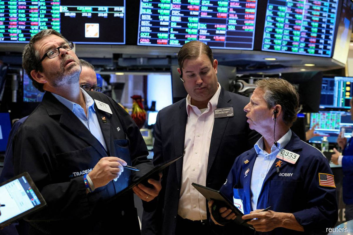 Wall St ends volatile day lower after Fed minutes, PPI