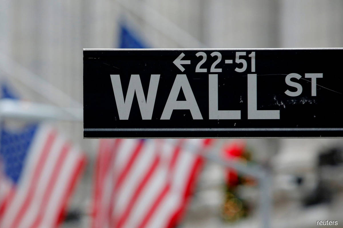 Wall Street ends lower as Apple and Tesla retreat