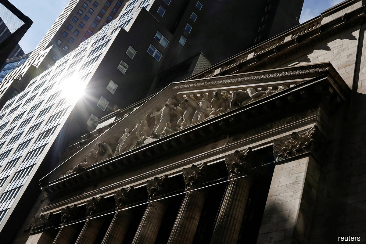 Wall Street closes lower as virus spike hits travel stocks