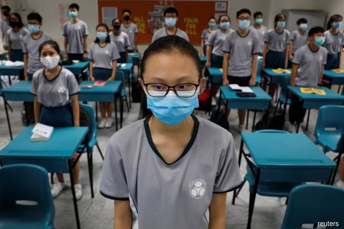 Singapore warns children susceptible to virus variants, shuts schools | The  Edge Markets
