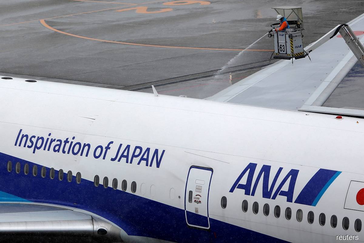 Japanese airline ANA reports narrower 1Q operating loss
