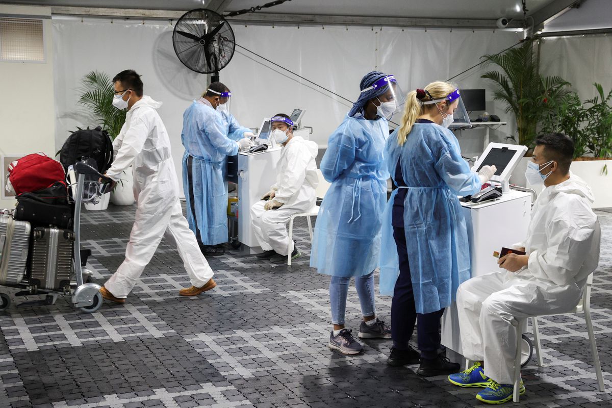 Travellers receive tests for Covid-19 at a pre-departure testing facility, as countries react to the new coronavirus Omicron variant, outside the international terminal at Sydney Airport in Sydney, Australia, Nov 29, 2021. (Photo by Reuters)