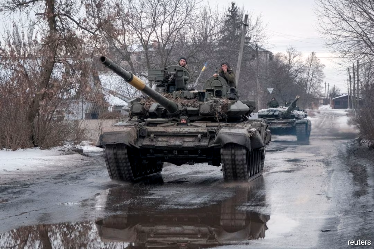 Ukrainian service members riding tanks, as Russia's attack on Ukraine continued, near the frontline town of Bakhmut in the Donetsk region of Ukraine on Feb 21, 2023.