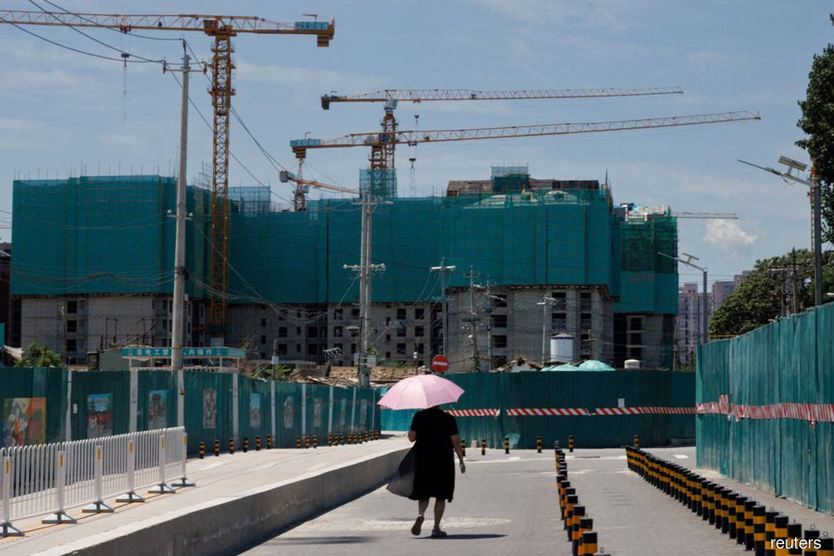 Chinese developers in 'survival mode' slash property investment