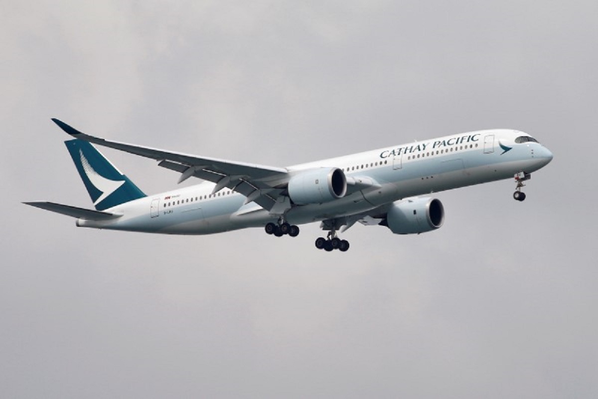 Cathay Pacific's loss shrinks in first half, risks to overseas slots flagged