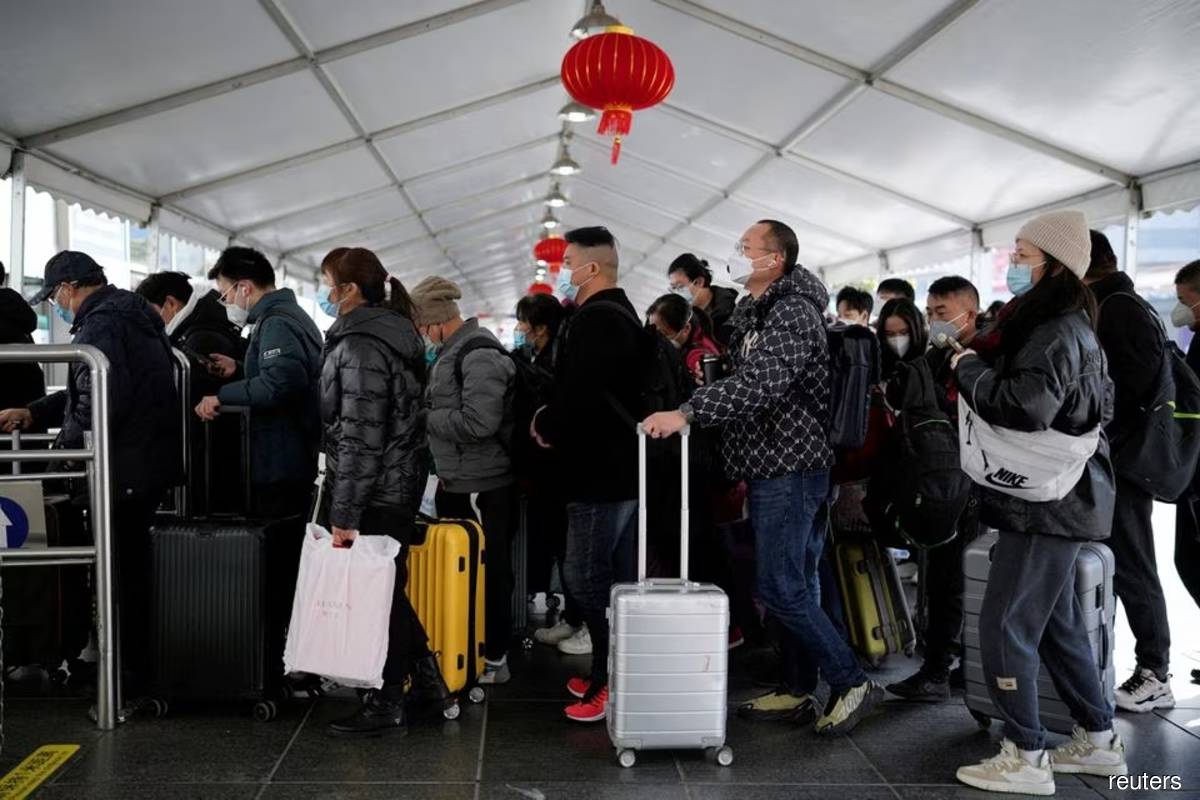 China plays down Covid-19 outbreak with holiday rush at full tilt