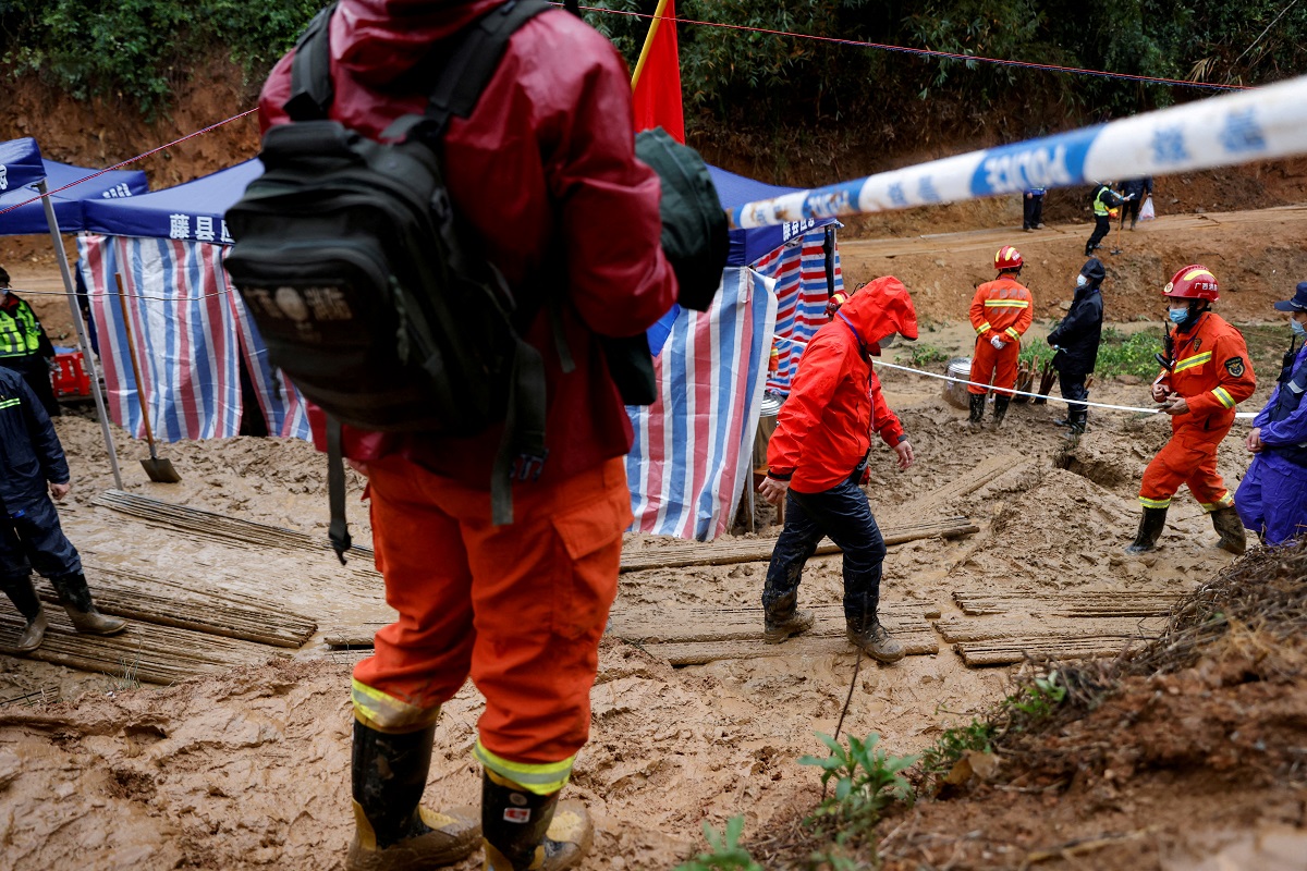 Rescue workers work at the site where a China Eastern Airlines Boeing 737-800 plane flying from Kunming to Guangzhou crashed, in Wuzhou, Guangxi Zhuang Autonomous Region, China March 24, 2022. (Photo by Reuters)