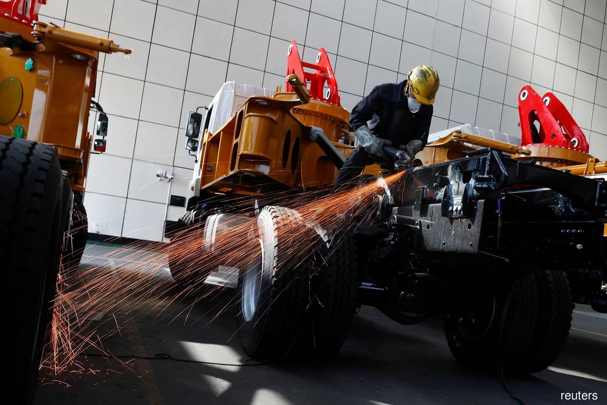 China's industrial profits slump in Jan-Feb as Covid pain lingers