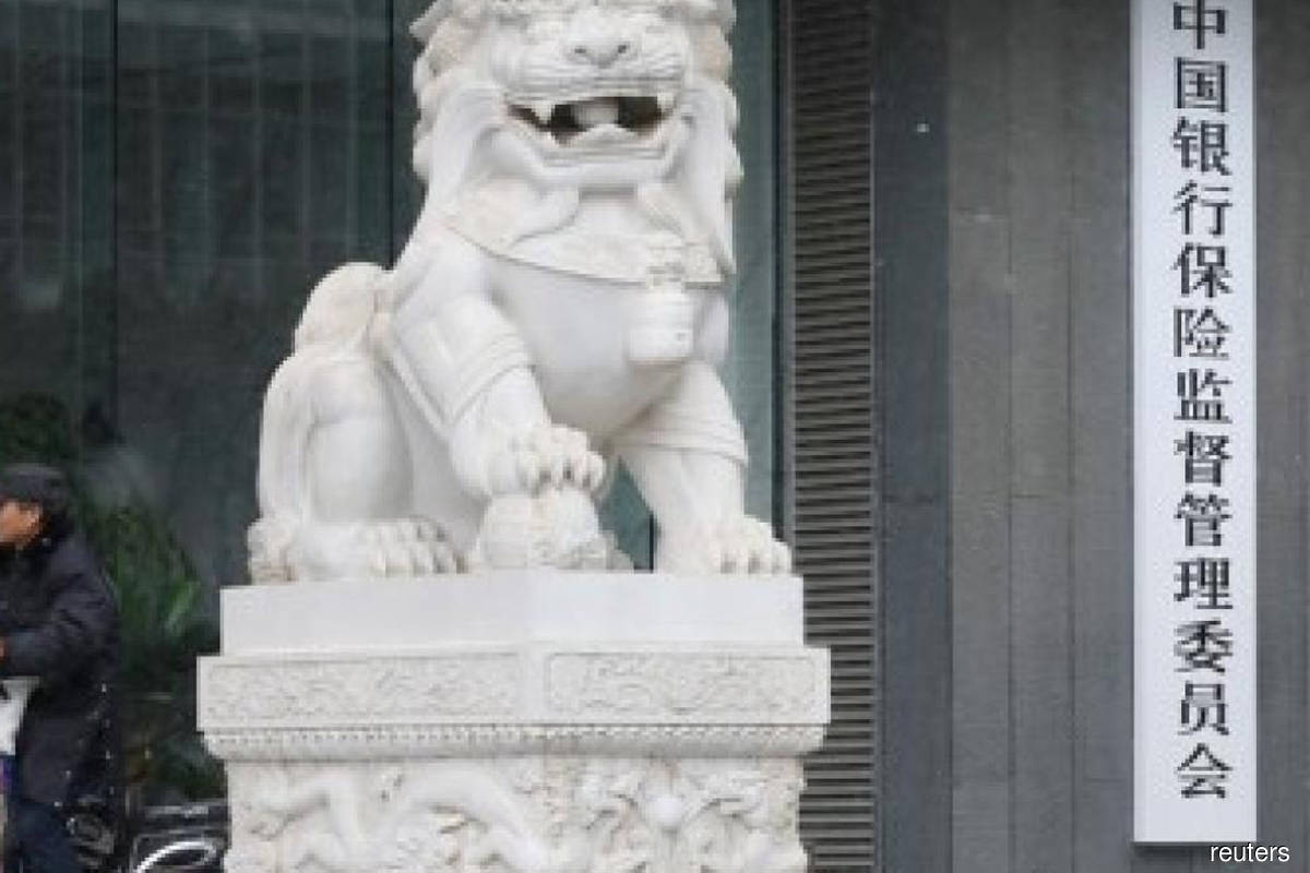 China tells some banks to further cut amount of cash-management products sold — sources