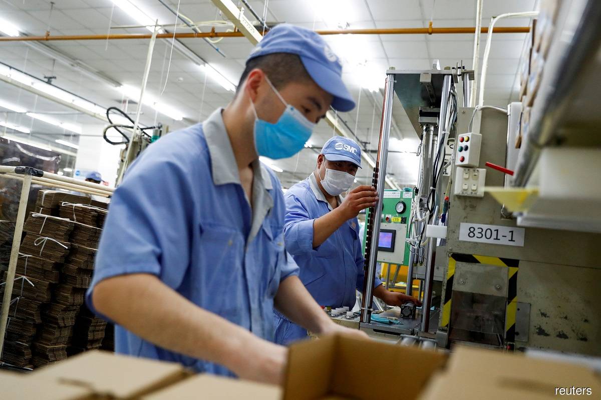China's factories, retailers stumble on Covid-19 disruptions