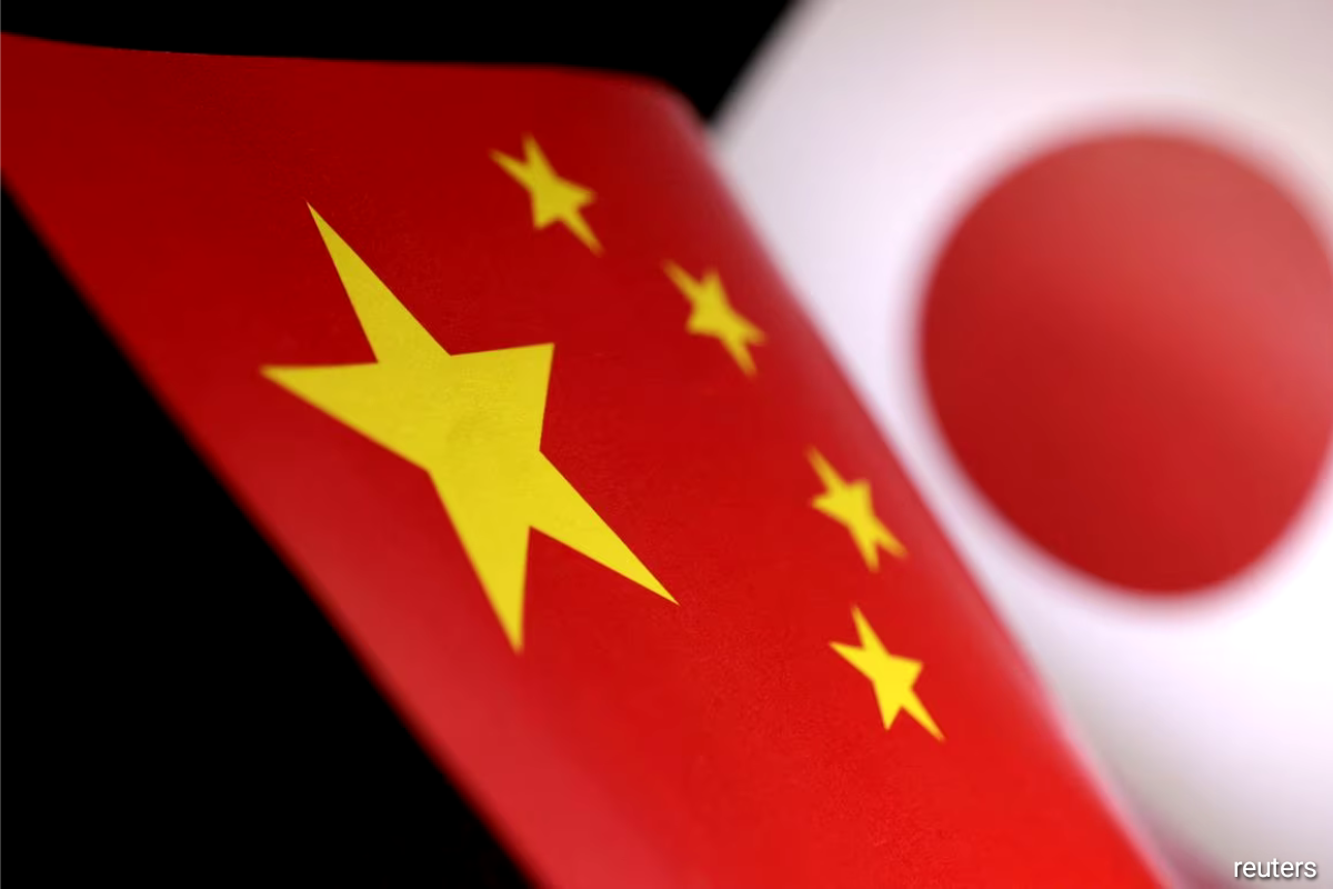 China tells Japan it is troubled by Tokyo's military build-up