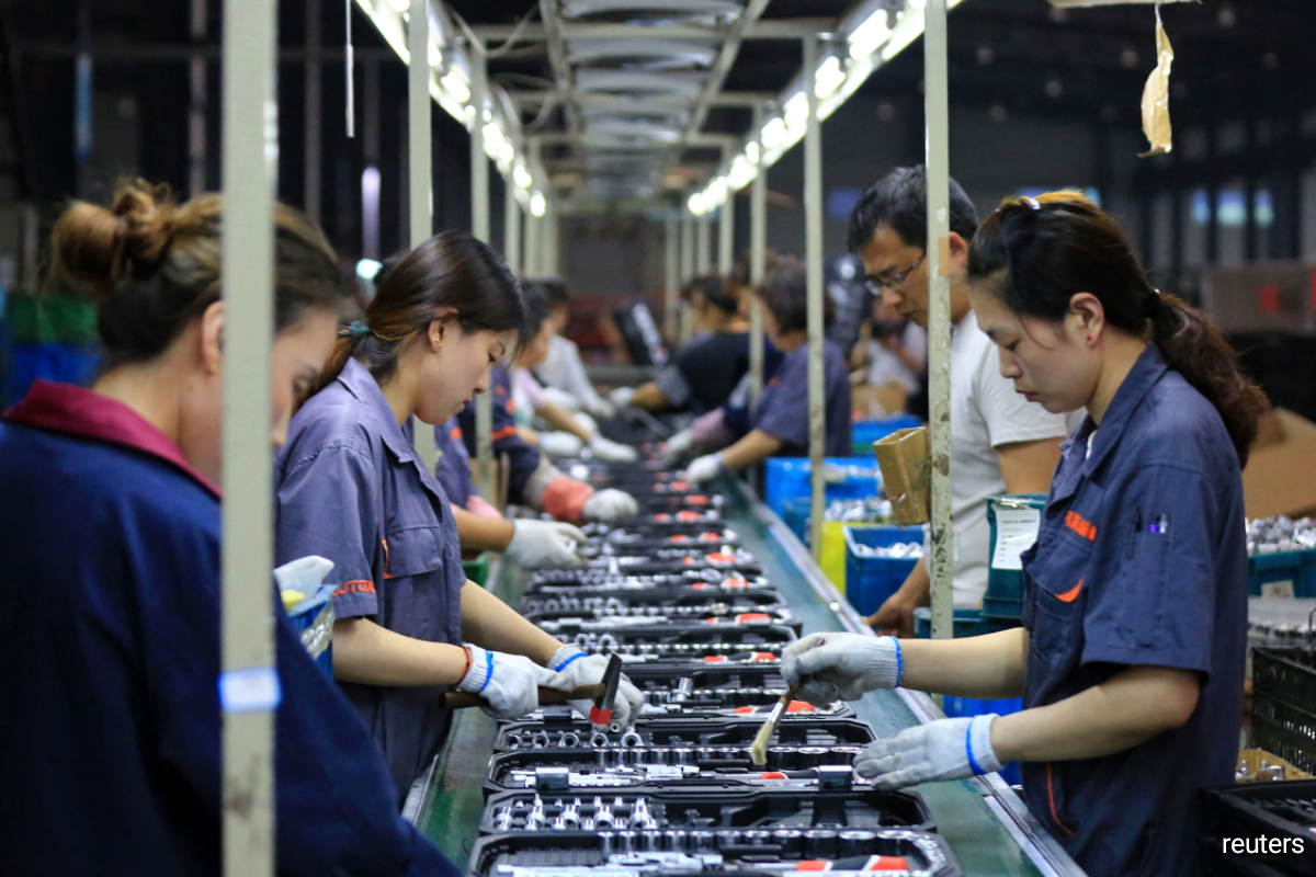 China’s manufacturing sector improved in May, surveys show