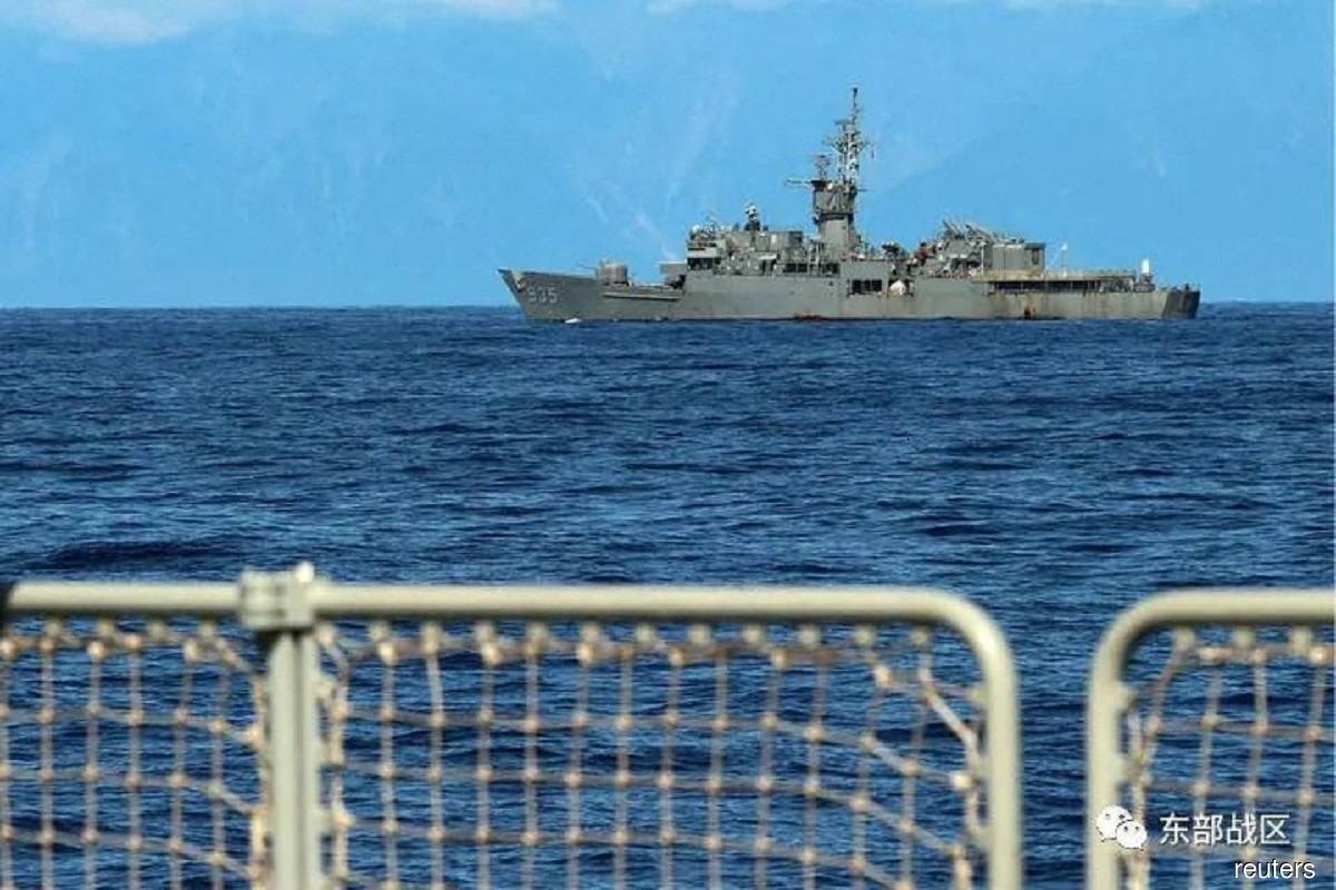 Chinese and Taiwanese warships eye each other as drills due to end