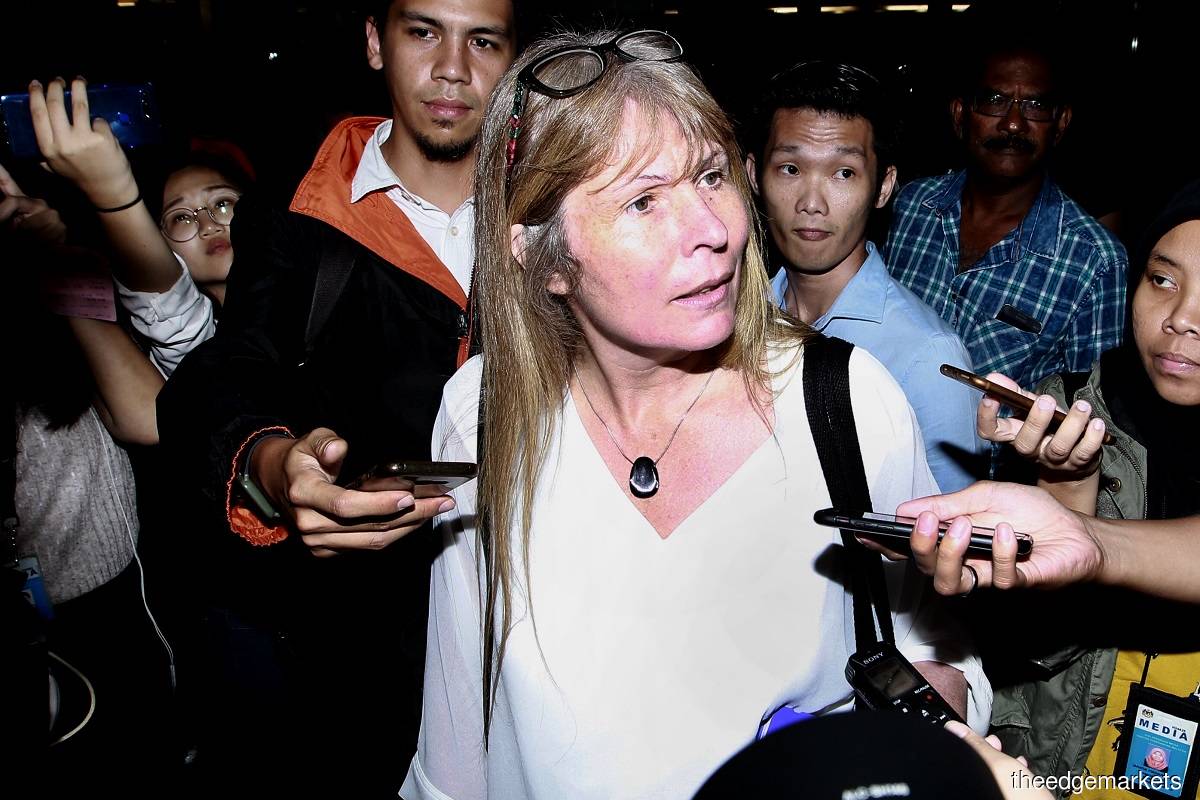 Rewcastle-Brown (centre) was supposed to appear in court today. (The Edge file photo)