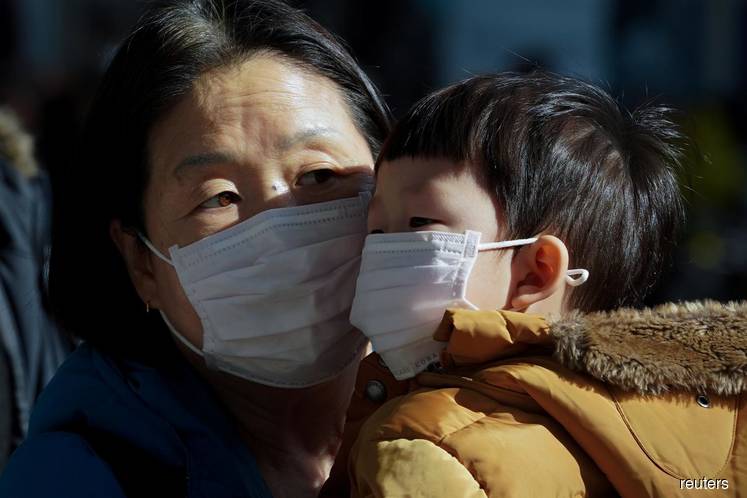 South Korea reports 52 more virus infections as outbreak 