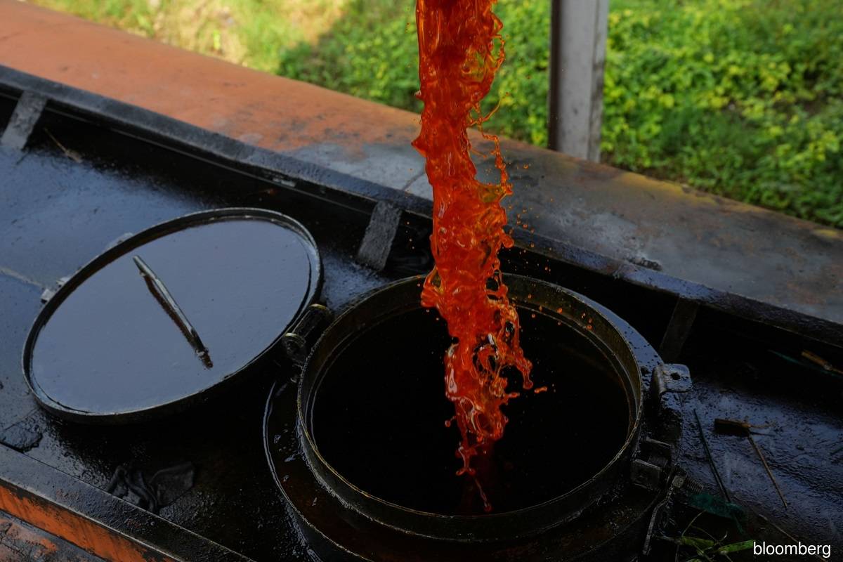 A truck receives crude palm oil from a tank at the Cikasungka palm oil processing factory, operated by PT Perkebunan Nusantara VIII, in Bogor Regency in West Java, Indonesia, on Monday, June 20, 2022.
