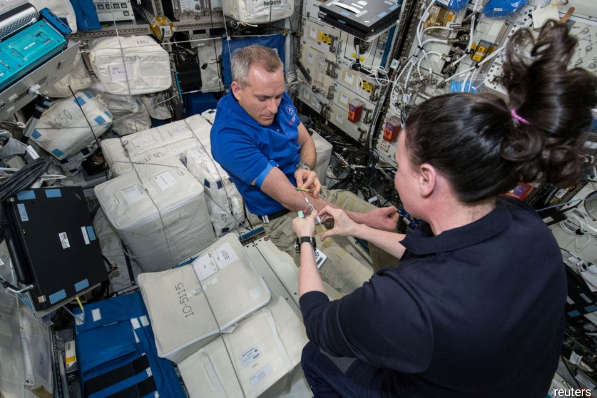 David Saint-Jacques has his blood drawn aboard the International Space Station.