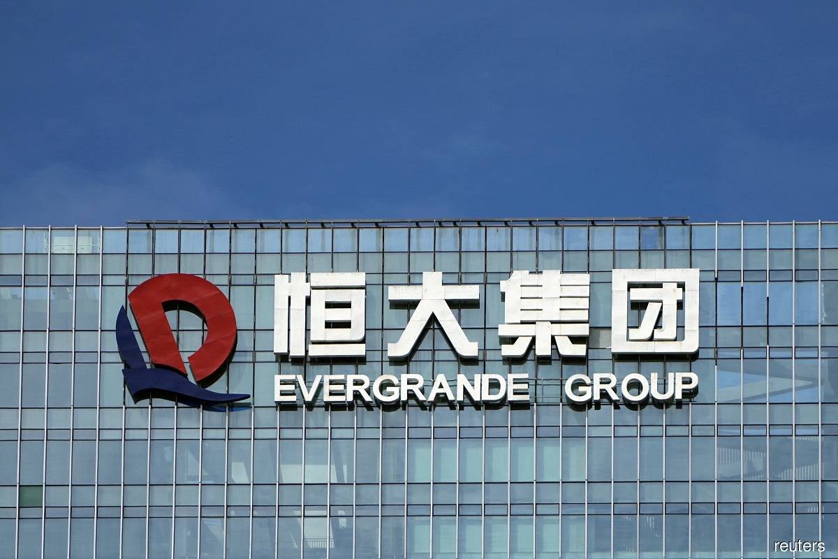 Evergrande vows debt payment after restructuring delay
