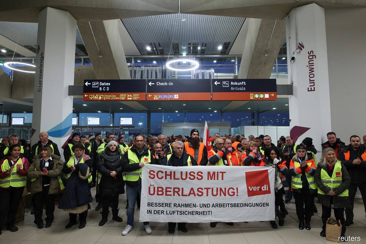 Airport workers protest at Cologne-Bonn airport during a strike called by German trade union Verdi in Cologne, Germany, Feb 27, 2023.