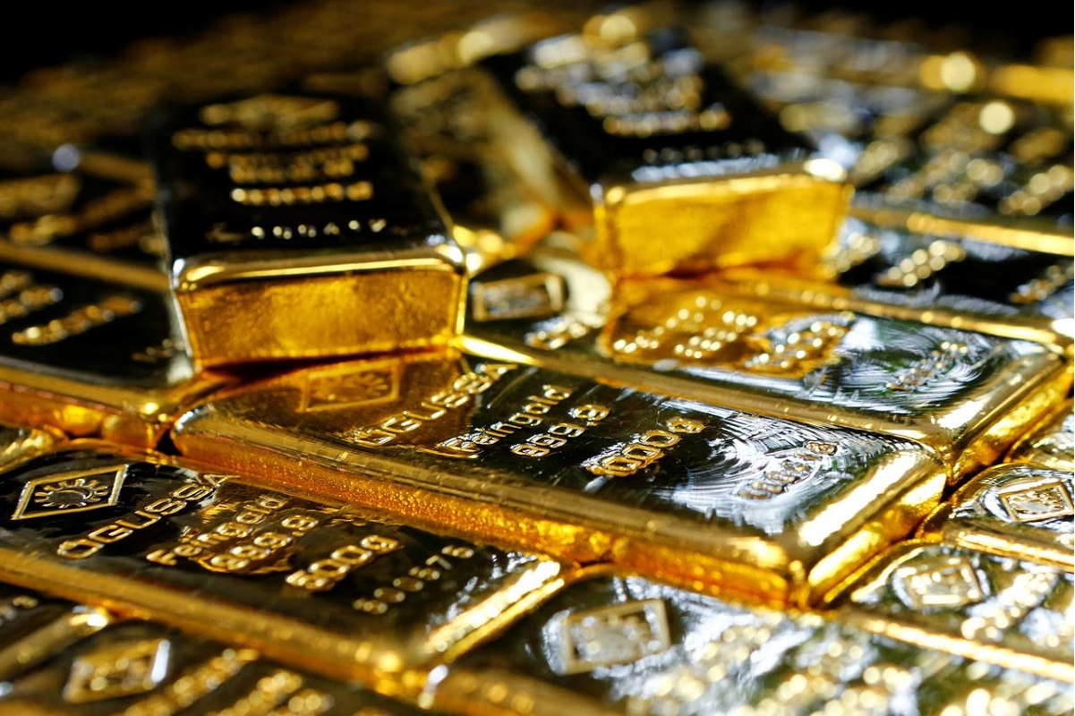 Gold slips as US dollar checks slide, Fed chief hardens policy stance