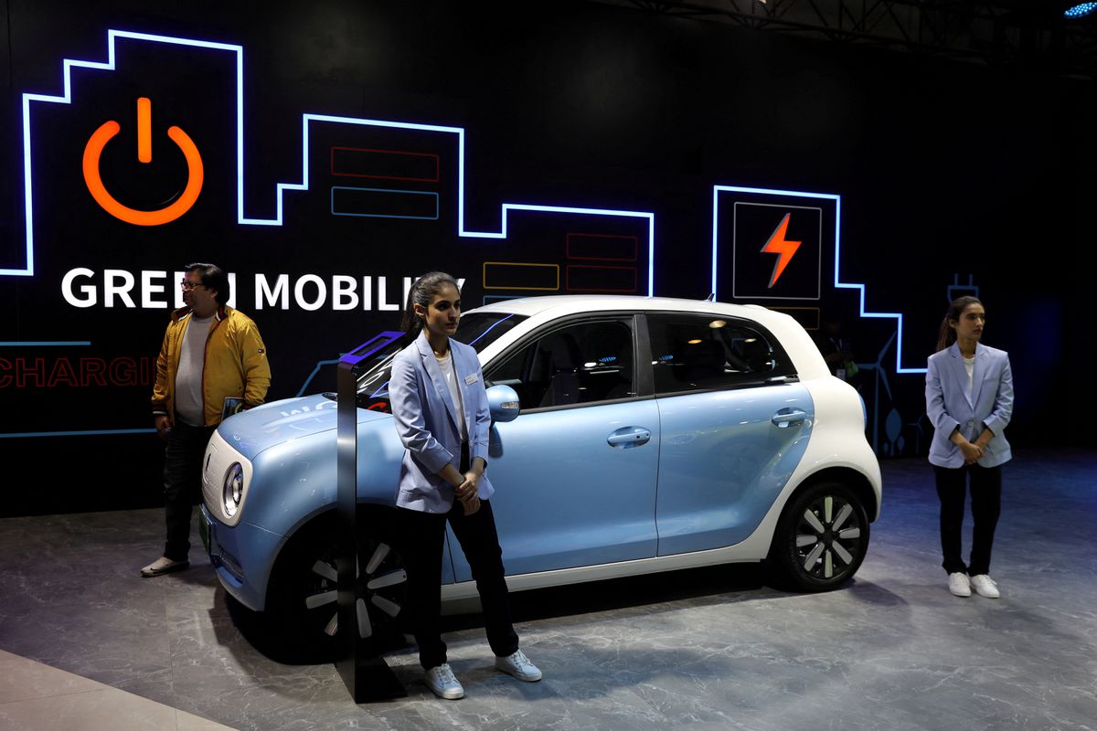 Models pose next to Great Wall Motors (GWM) GWM R1 electric car at its pavilion at the India Auto Expo 2020 in Greater Noida, India, Feb 5, 2020. (File photo by Reuters)