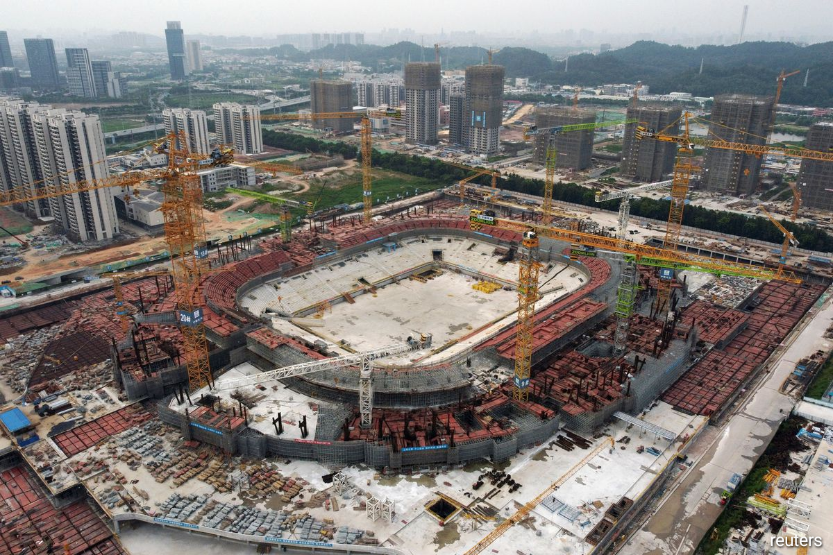 Construction on the 12 billion yuan ($1.86 billion) Guangzhou Evergrande Football Stadium began in April last year for completion by the end of 2022, when it was set to be the world's largest soccer venue by capacity.