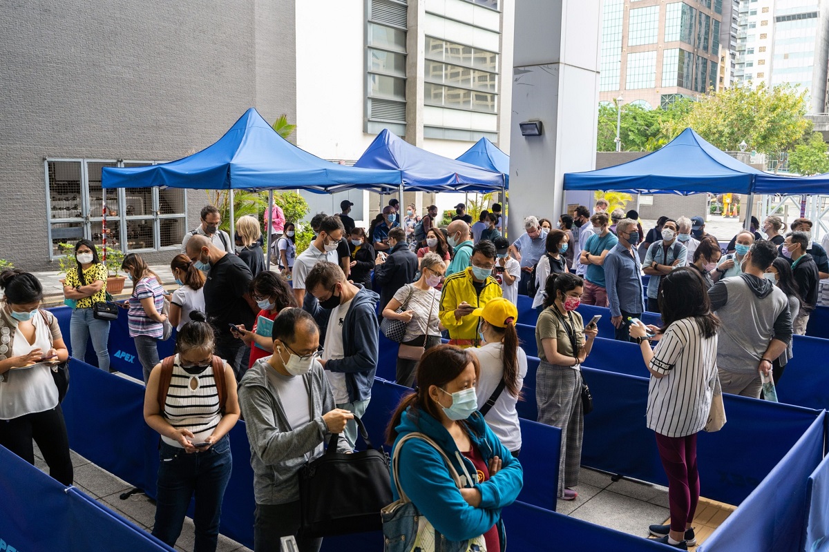 Hong Kong loosens quarantine for travellers, close contacts