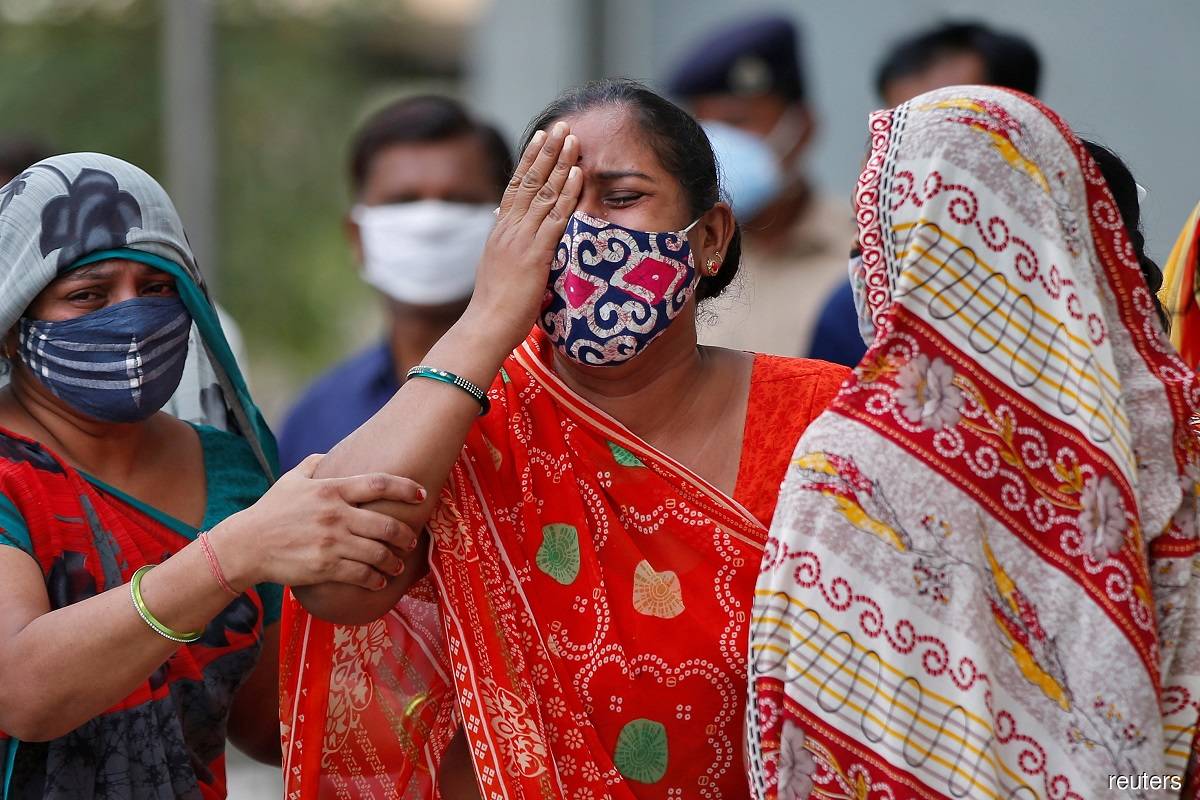 India turns to ex-army medics as Covid-19 surge sparks calls for lockdown