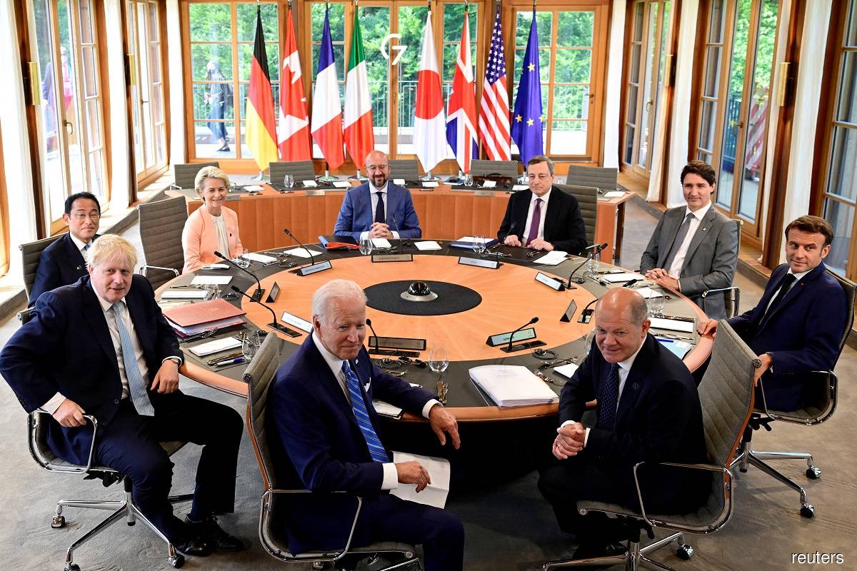 (Clockwise from centre, foreground) US President Joe Biden, UK Prime Minister Boris Johnson, Japan Prime Minister Fumio Kishida, European Commission President Ursula von der Leyen, European Council President Charles Michel, Italy Prime Minister Mario Draghi, Canada Prime Minister Justin Trudeau, France President Emmanuel Macron, and Germany Chancellor Olaf Scholz attending a meeting of the first working session of the Group of Seven summit at Bavaria's Schloss Elmau Castle in Germany on June 26, 2022.
