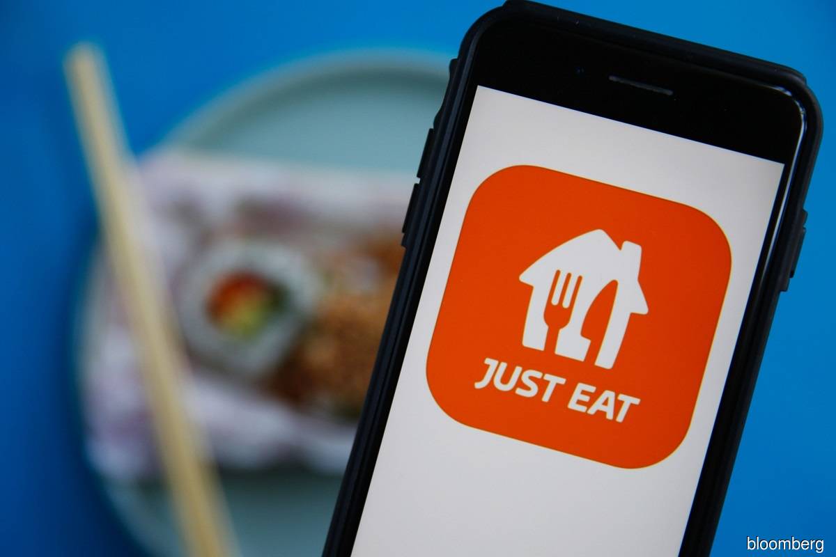 Just Eat Takeaway weighs GrubHub sale, scales back 2022 growth view