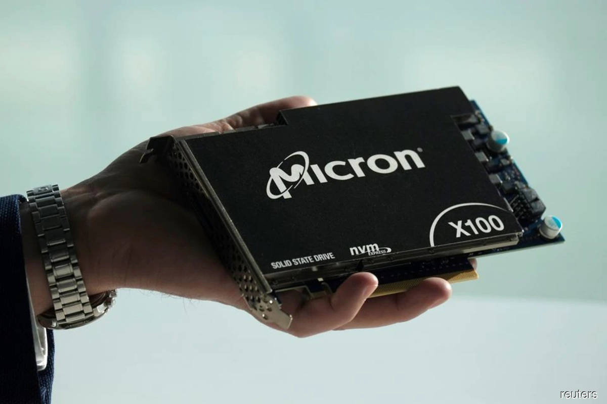 Chip stocks fall as Micron outlook signals easing demand