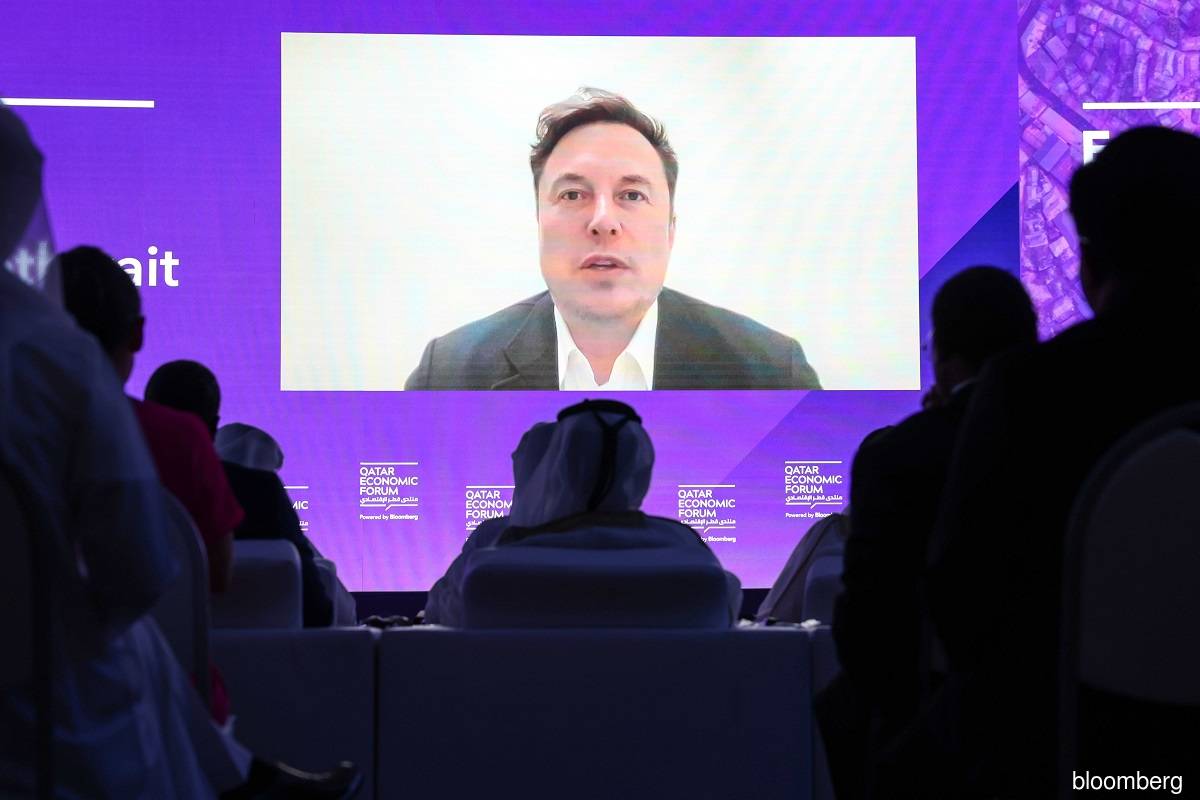 Elon Musk speaks via video link during the Qatar Economic Forum in Doha, on June 21.
