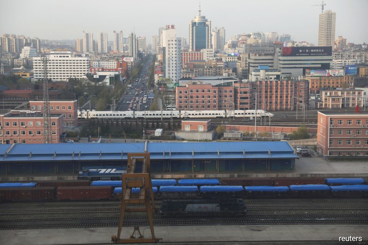 Freight cars seen at a train station in Dandong, Liaoning province, China on April 21, 2021. (Photo by Tingshu Wang/Reuters)
