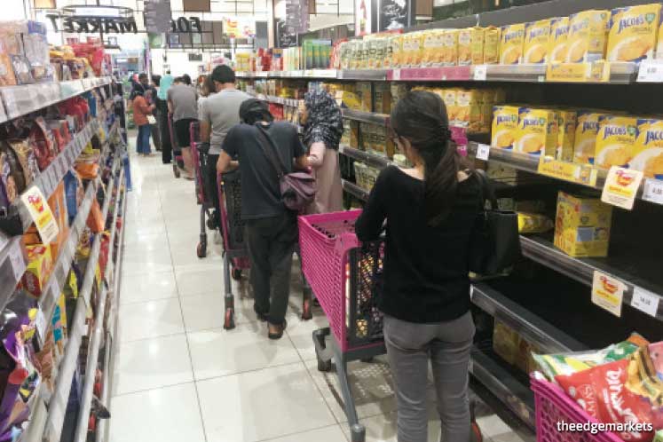 Items that have been flying off the shelves include toilet paper, canned food, instant noodles and frozen food, says Tan. Rice, flour, eggs, pasta and mushrooms are also selling fast. (Photo by Abdul Ghani Ismail)