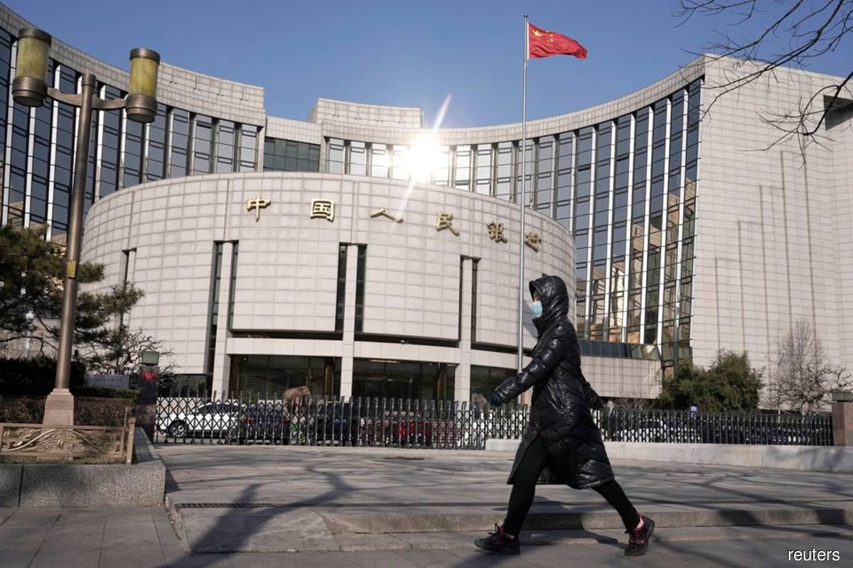 China to curb banks' use of overseas loans