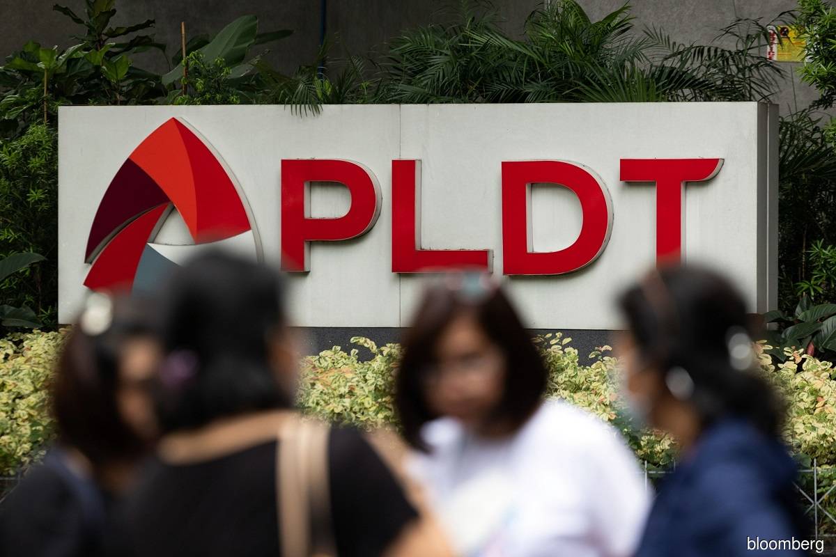 Top Philippine telco snaps rout as it vows to assist probe