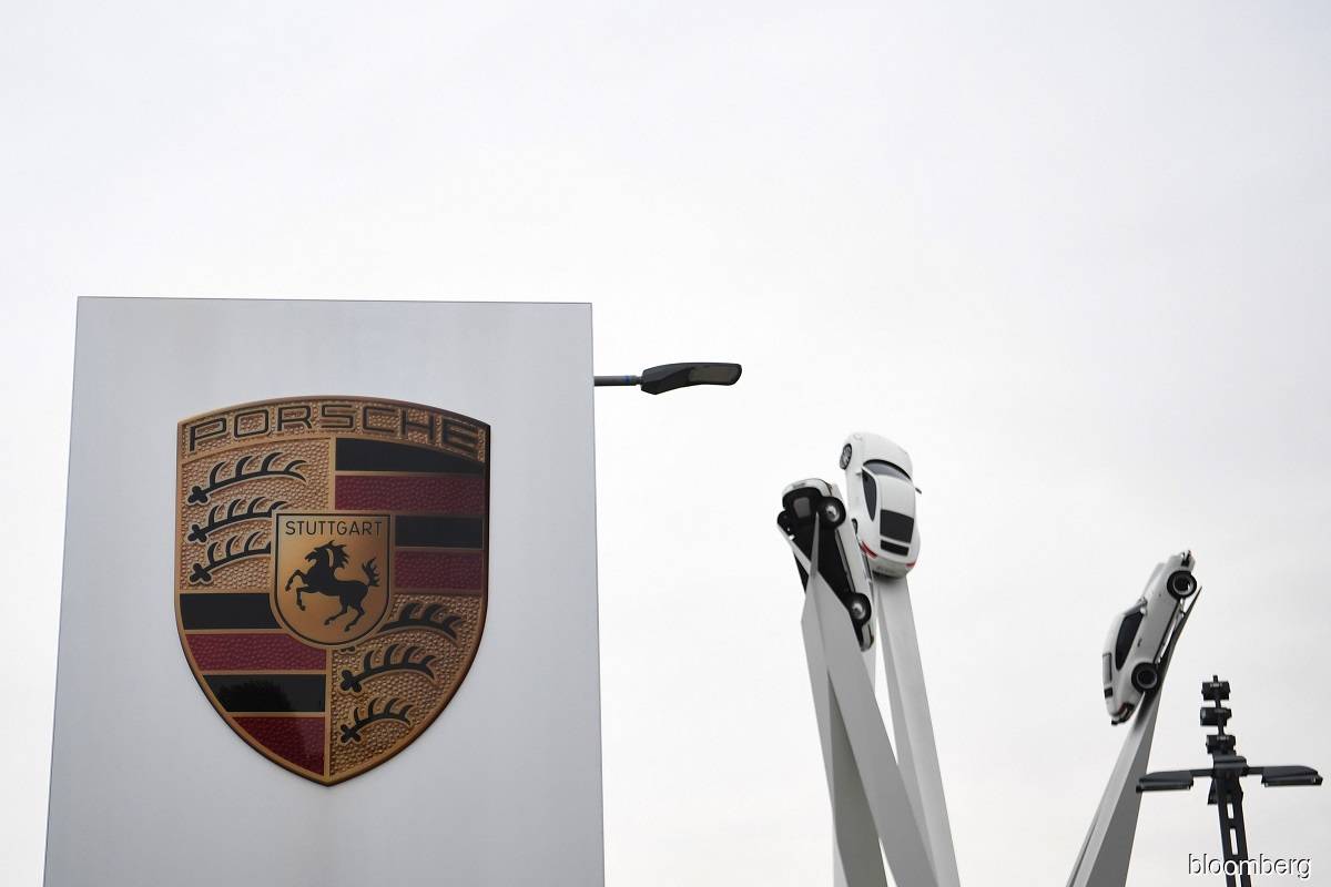 Porsche rises in landmark IPO weathering tough markets
