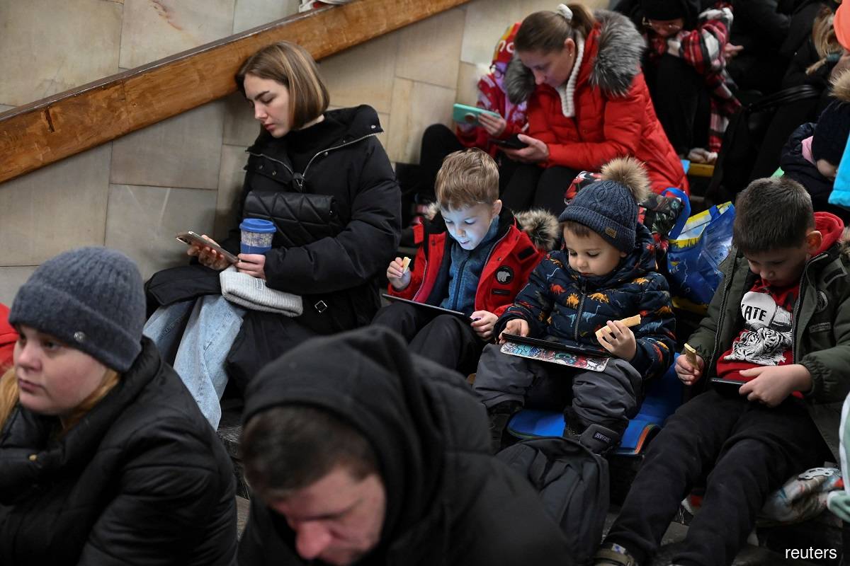 Air raid alarms had sounded across Ukraine as people headed to work. In the capital, crowds took cover for a time in underground metro stations.