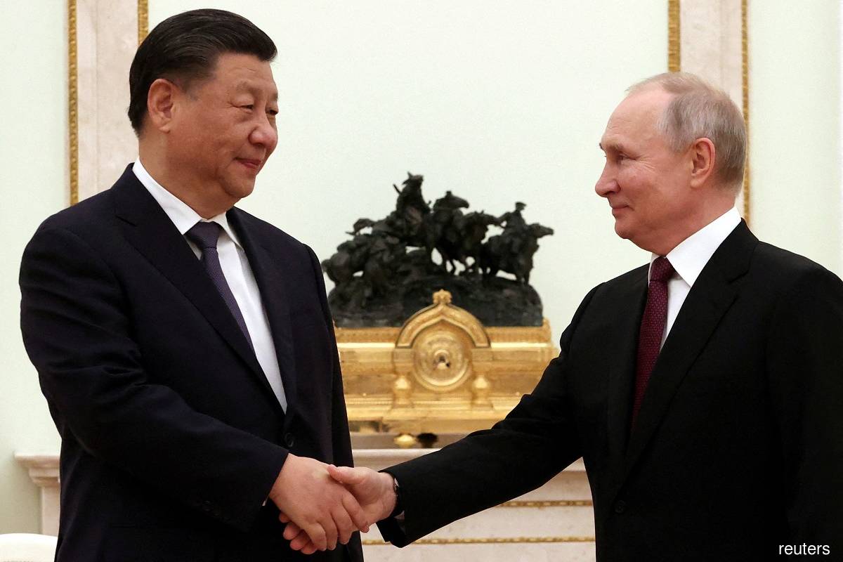 Putin praised by China's Xi on visit to Moscow US denounces as cover for war crimes