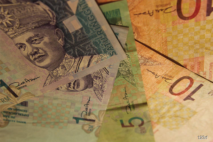 Ringgit advances as oil climbs to two-year high