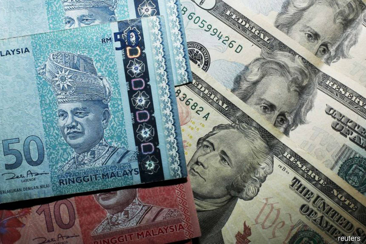 Ringgit opens easier against US dollar
