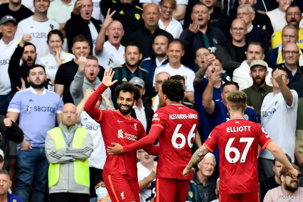 Salah joins 100 club as Liverpool win at Leeds in match marred by Elliott injury