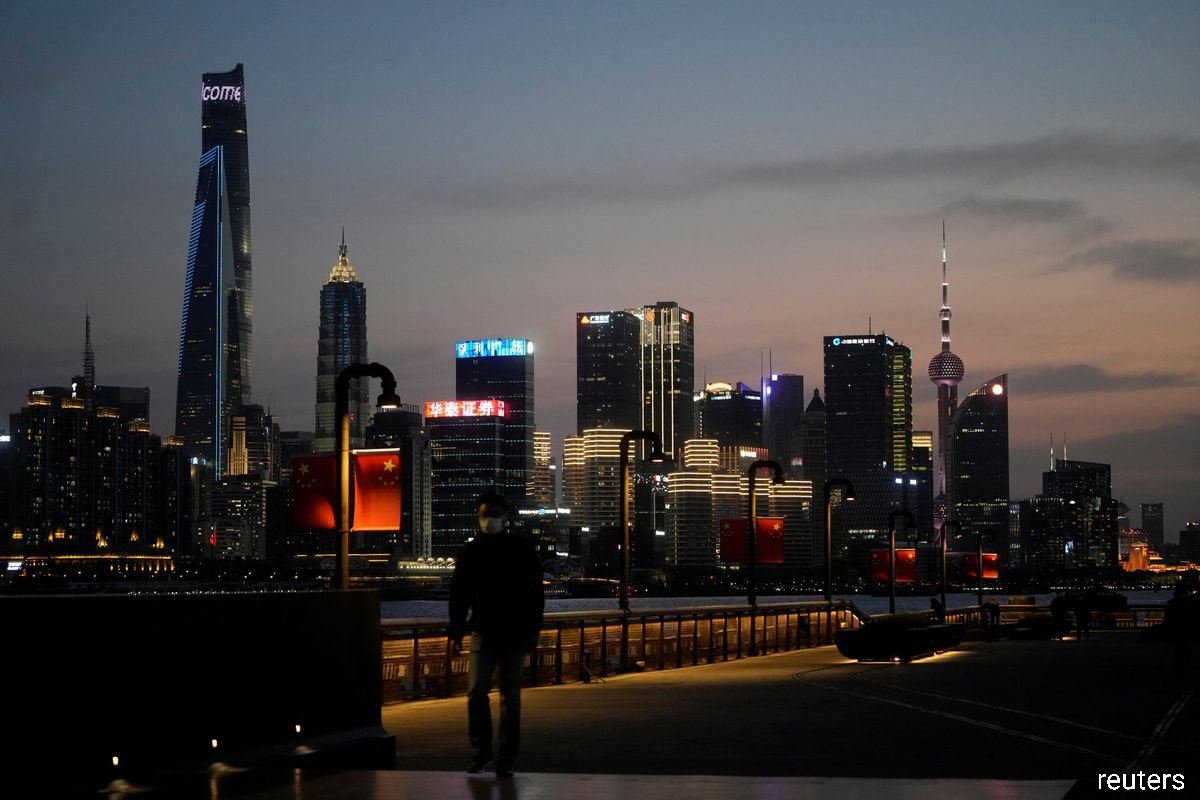 Some residents in Beijing were allowed to return to work, while Shanghai (pictured) inched closer towards lifting its two-month old Covid-19 lockdown from Wednesday, as the number of infections across China dropped. (Photo by Reuters)