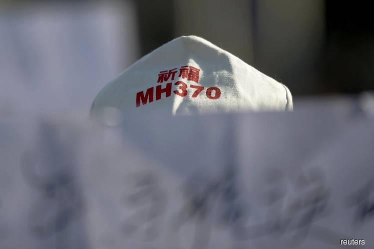 Malaysia says MH370 report to be released after latest search ends