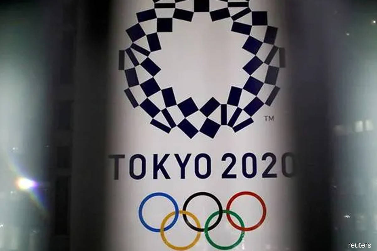 Japan may keep some virus curbs until Games start — report