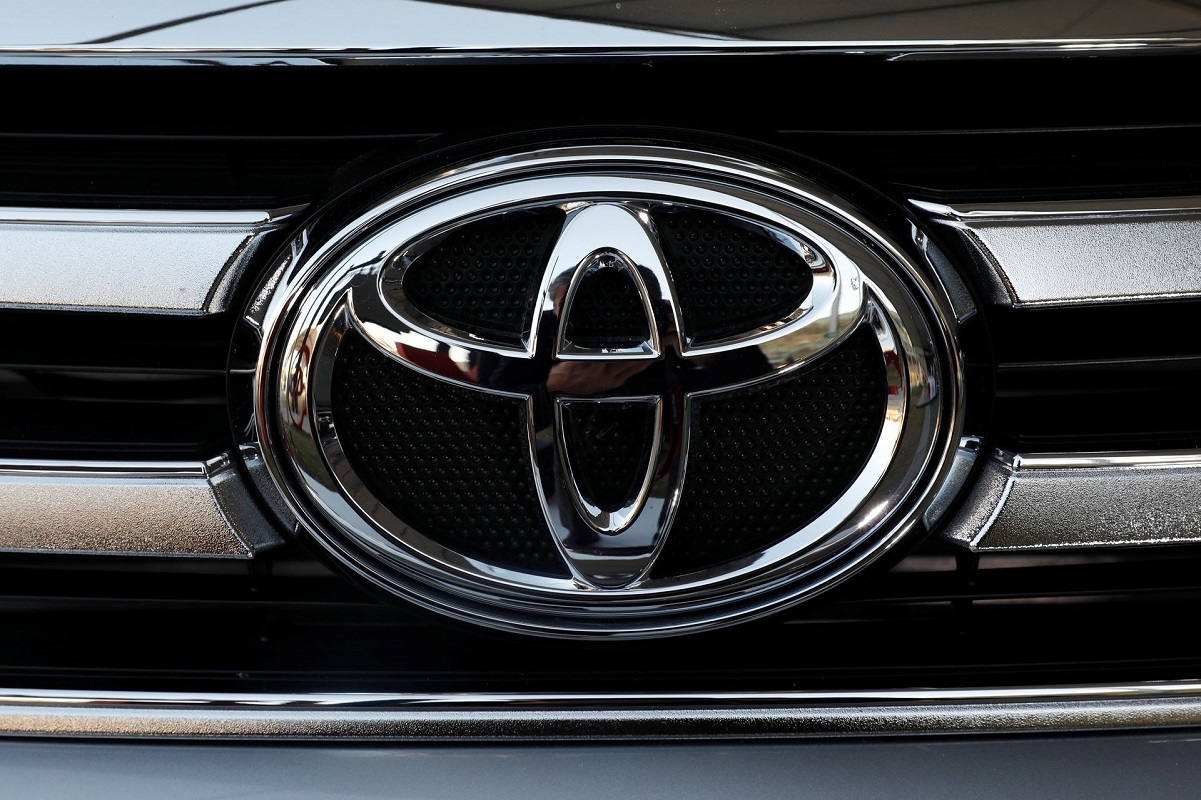 Toyota rolls out first battery electric car in cautious debut as rivals go full-throttle