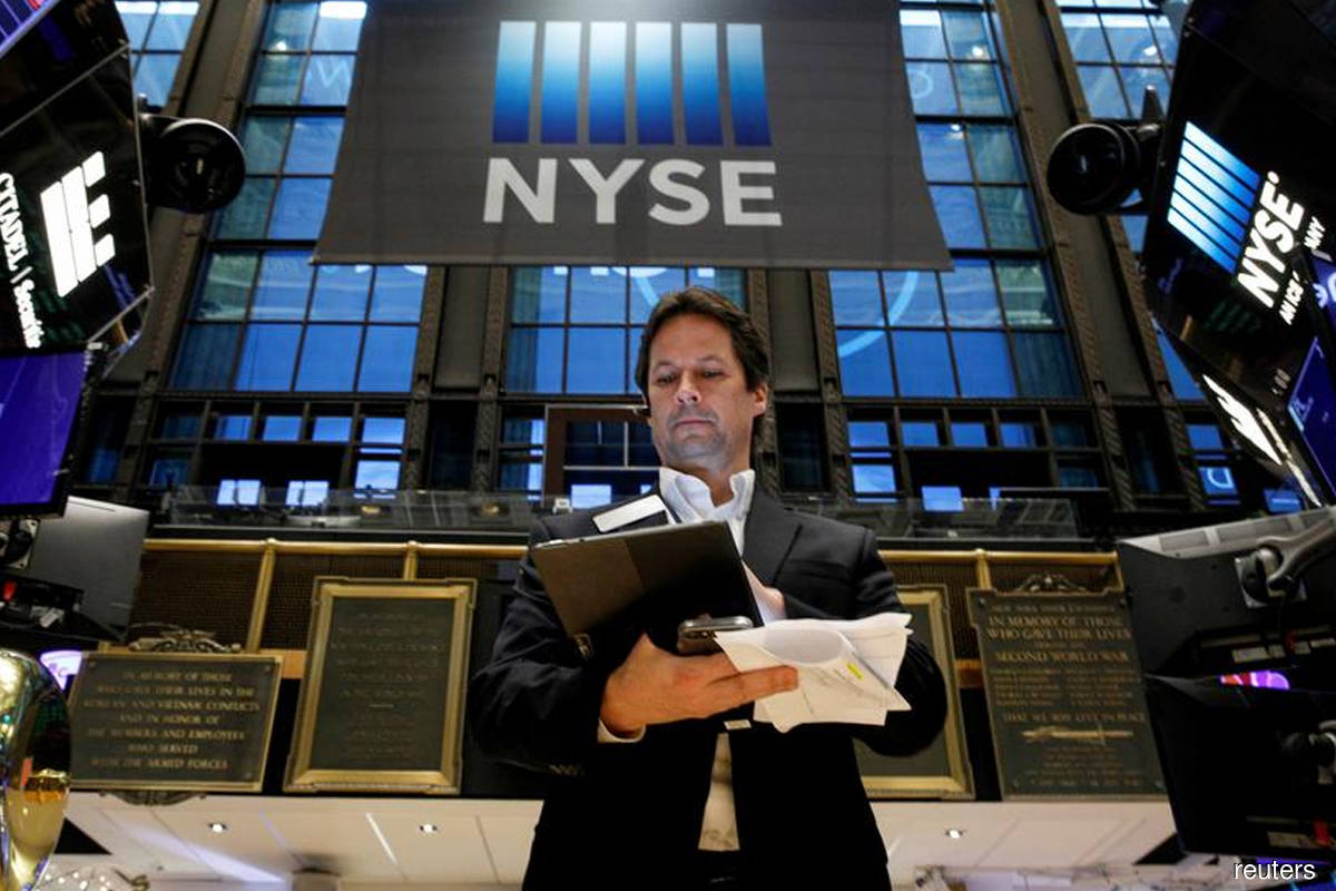 Wall St closes higher as vaccine update feeds optimism