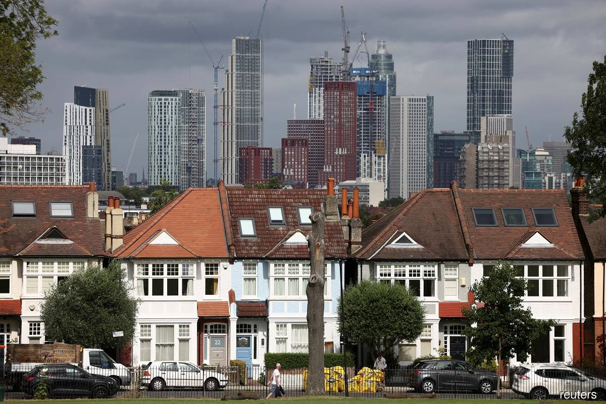 UK house prices fall more sharply after mortgage costs jump, says lender